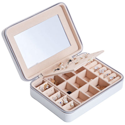 Multifunctional jewelry storage box in white leather with compartments for earrings and rings and built-in mirror.