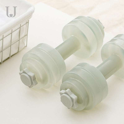 Pair of transparent fitness water dumbbells for home exercise and strength training