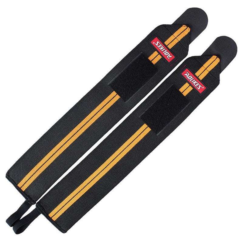 Pair of black and orange power wrist wraps with Velcro straps for gym support and stability