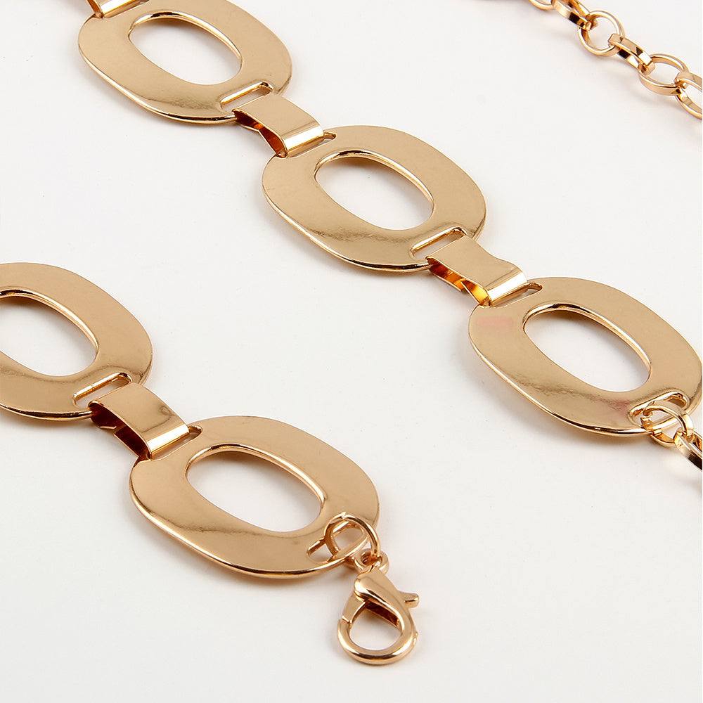 Gold-tone metal summer jewelry waist chain with large hollow oval links and lobster clasp closure