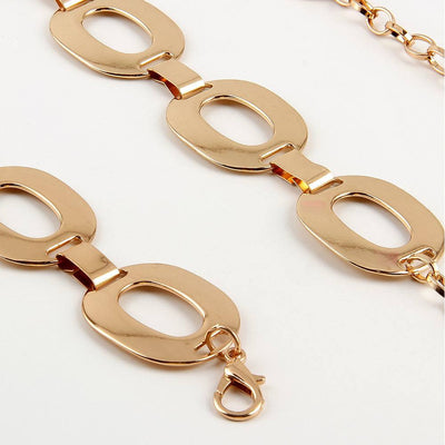 Gold-tone metal summer jewelry waist chain with large hollow oval links and lobster clasp closure