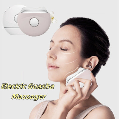 Woman using electric Guasha massager on face for skin firming and wrinkle removal