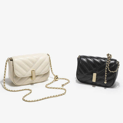 Two oval soft PU leather fashion chain bags in white and black with single chain shoulder straps and rhombus quilted design