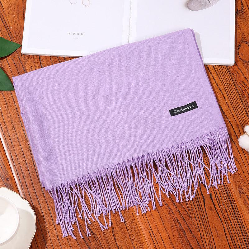 Soft lavender women scarf shawl with fringe detailing on wooden surface