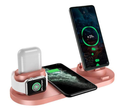 Rose gold wireless charger station charging phone, smartwatch, and wireless earbuds simultaneously