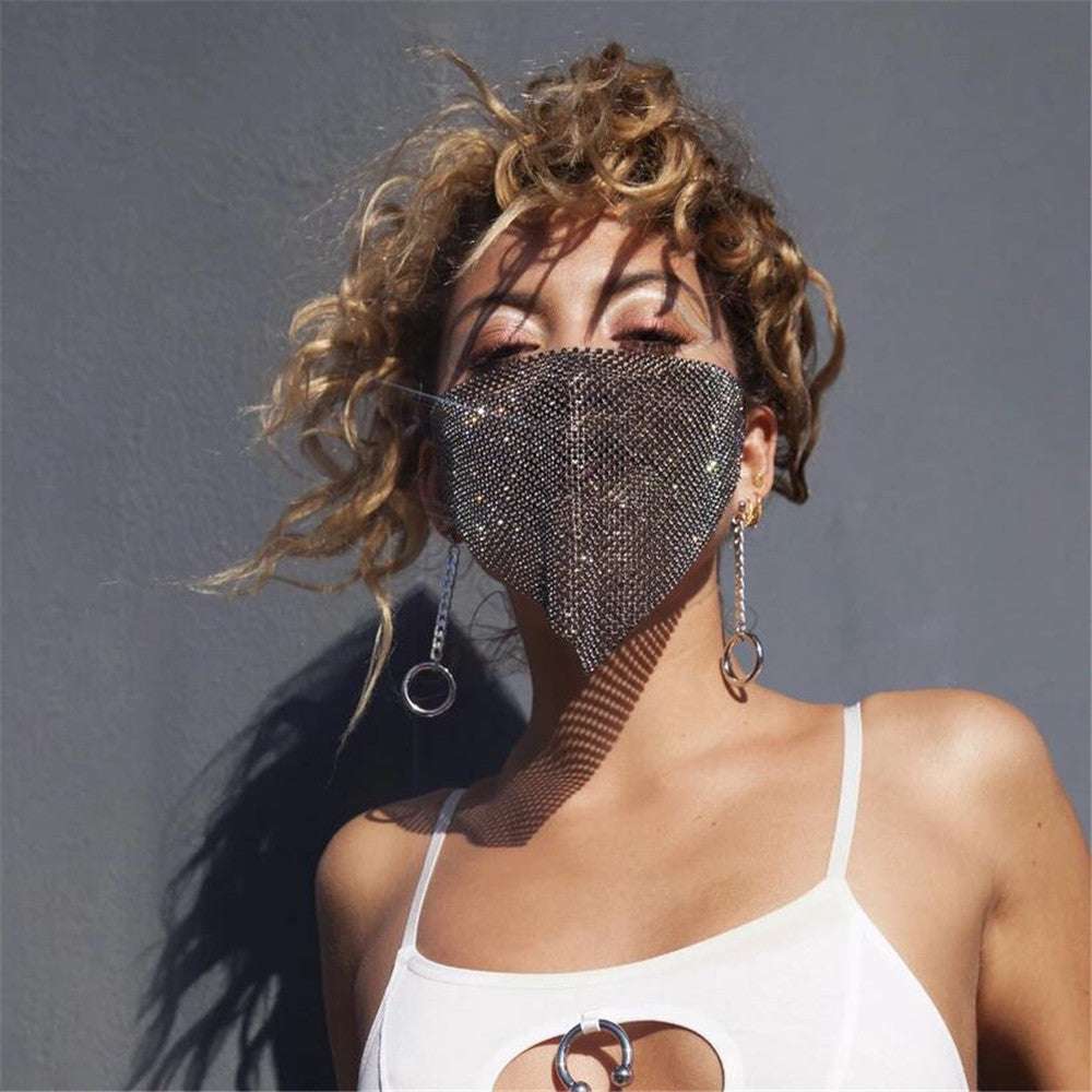 Unisex rhinestone metal jewelry mask with chain necklace accessory on person with curly hair