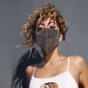Unisex rhinestone metal jewelry mask with chain necklace accessory on person with curly hair
