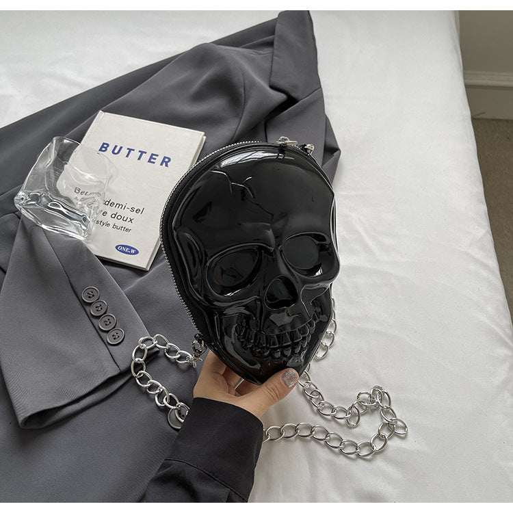 Black silicone women's fashion chain bag in skull shape with single shoulder strap, soft material, stylish crossbody design