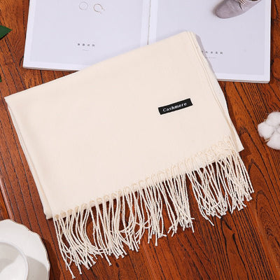 Cream-colored women's cashmere scarf shawl with fringed edges, soft and skin-friendly winter wrap.