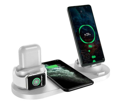 White 6-in-1 wireless charger dock station charging AirPods, Apple Watch, and two smartphones simultaneously