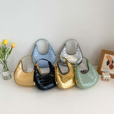 Set of six fashion pattern air bag women’s small PU crossbody bags in green, blue, black, silver, and gold colors with dumpling shape and zipper opening