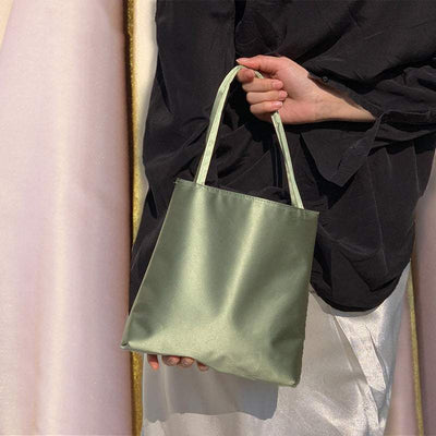 Glossy green women's new fashion handbag with soft carry handle and bucket shape design