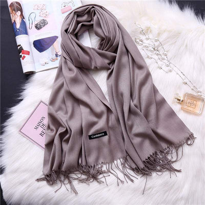 Soft multi-color cashmere women scarf shawl with fringes on white fur background